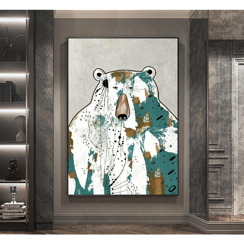 May include: Abstract bear art print. The artwork features a bear with a white body, teal and brown accents, and black dotted lines. The bear is set against a gray background, framed in black, and displayed in a modern interior.