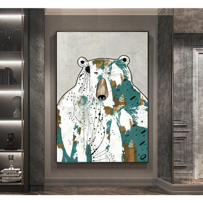 May include: Abstract bear art print. The artwork features a bear with a white body, teal and brown accents, and black dotted lines. The bear is set against a gray background, framed in black, and displayed in a modern interior.