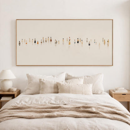 May include: A large rectangular framed artwork depicting a minimalist scene of numerous figures in various colors. The artwork hangs above a bed with cream-colored bedding and pillows, creating a serene bedroom setting.
