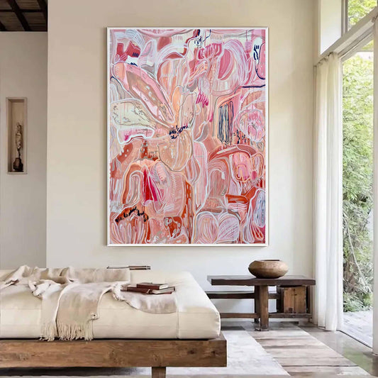 May include: Large abstract painting in a white frame. The artwork features a complex composition of organic shapes in shades of pink, red, and white, with hints of blue and orange. The style is expressive and modern, suitable for home decor.