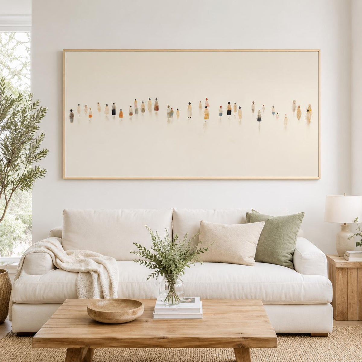 May include: A large rectangular framed artwork featuring a minimalist depiction of numerous figures in various colors. The artwork hangs above a white sofa with pillows, a wooden coffee table, and a vase of greenery.