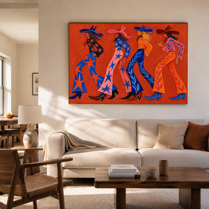 May include: A rectangular wall art piece featuring four figures walking in profile against a solid orange background. The figures wear colorful western-style outfits with star and leaf patterns, wide-leg trousers, and pointed boots in shades of blue, pink, and orange.
