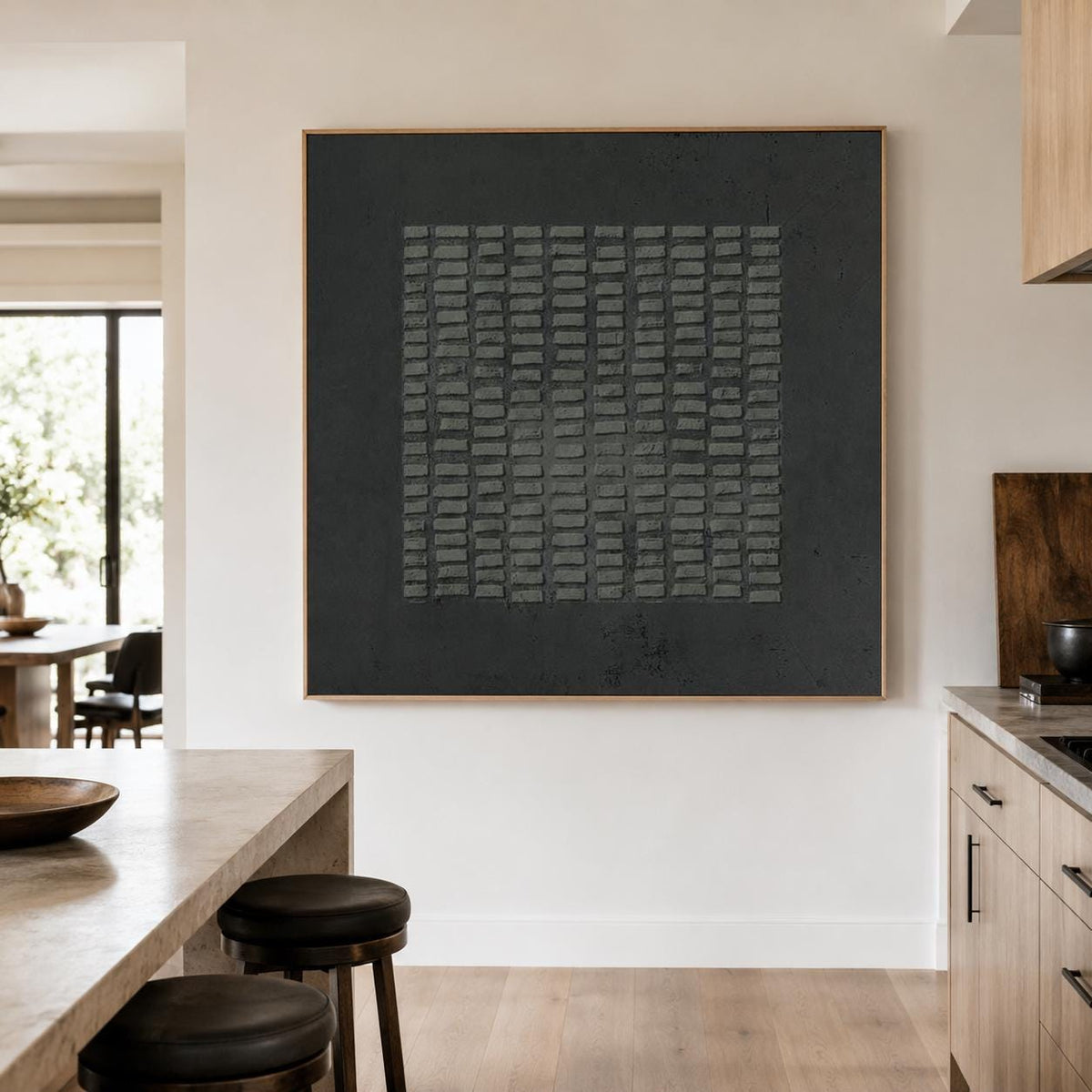 May include: A large square wall art piece featuring a solid matte black background with a central grid of raised, rectangular dark gray textured blocks arranged in vertical columns and horizontal rows, framed in a thin light wood border.