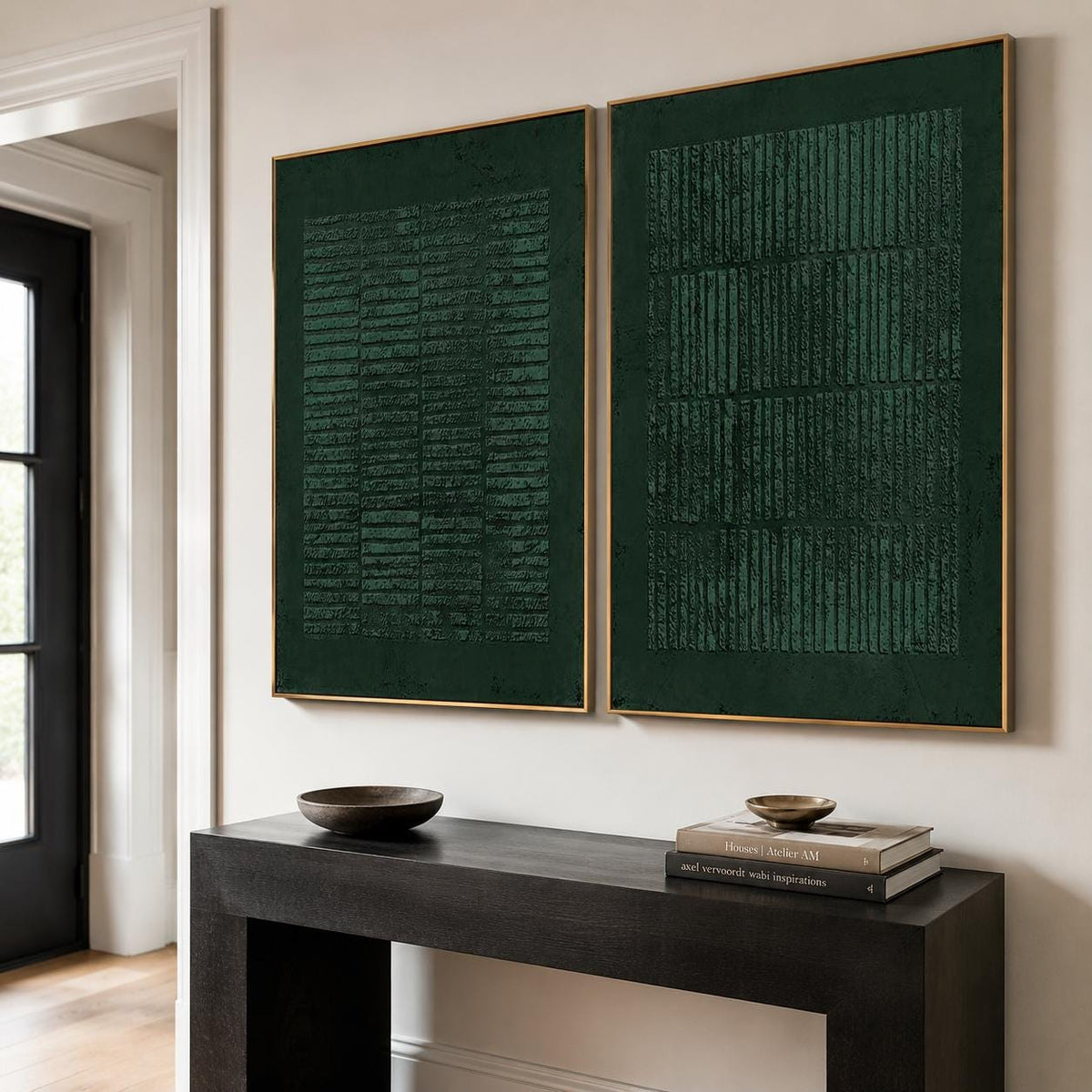 May include: Two rectangular wall art pieces in deep forest green, each framed in a thin gold border. The artwork features a textured, raised pattern of vertical and horizontal lines, creating a grid-like effect across the dark green surface.