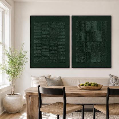 May include: Two rectangular wall art pieces in a deep forest green color, each featuring a textured surface with a pattern of vertical and horizontal lines. The artwork is framed in thin black borders and displayed side by side on a wall.