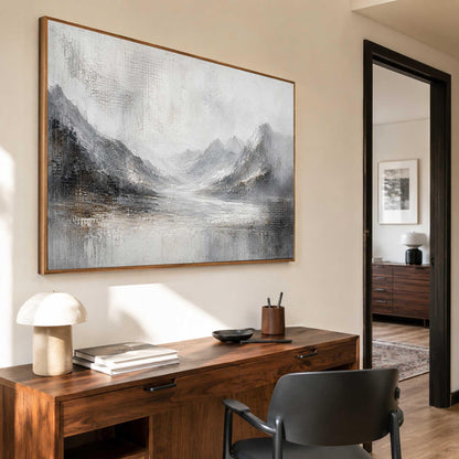 May include: A large rectangular wall art piece featuring an abstract landscape painting with textured brushstrokes in shades of white, gray, charcoal, and muted brown, depicting a mountain range overlooking a calm body of water in a wooden frame.