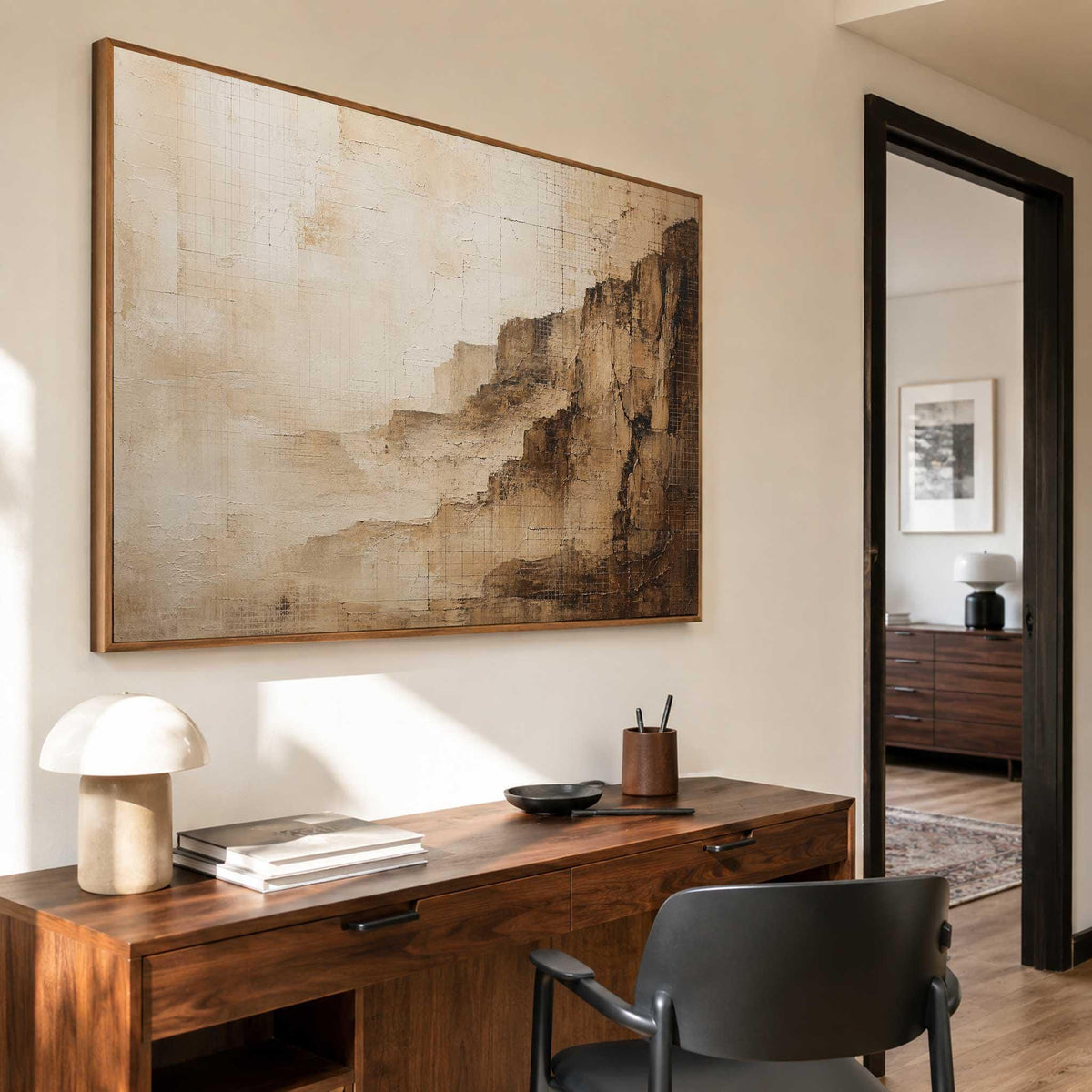 May include: A large rectangular wall art piece featuring an abstract landscape in shades of beige, cream, and dark brown. The painting displays textured, layered brushstrokes that suggest a rocky cliffside or canyon formation within a frame.