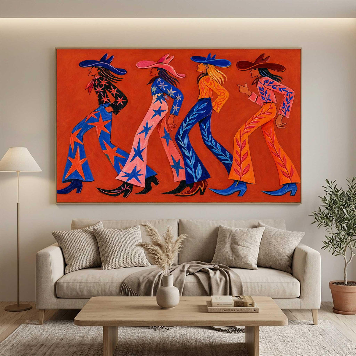 May include: A large rectangular wall art piece featuring four figures walking in profile against a solid orange background. Each figure wears a wide-brimmed hat and patterned trousers with star or leaf motifs, rendered in vibrant shades of blue, pink, and orange.