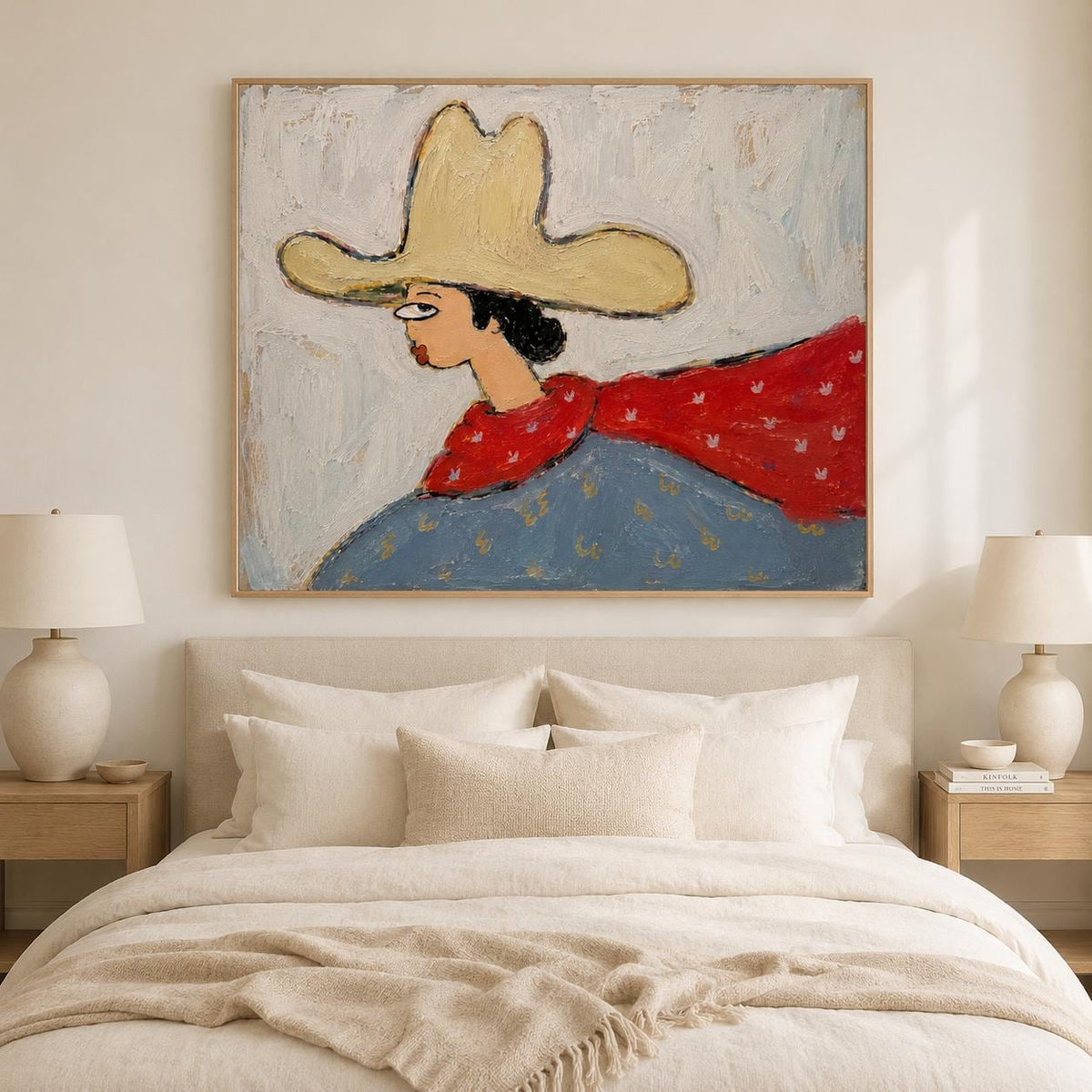 May include: A framed oil painting depicting a stylized figure wearing a large yellow hat, a red scarf with white patterns, and a blue garment. The artwork features visible brushstrokes and a textured surface, set against a light gray background.