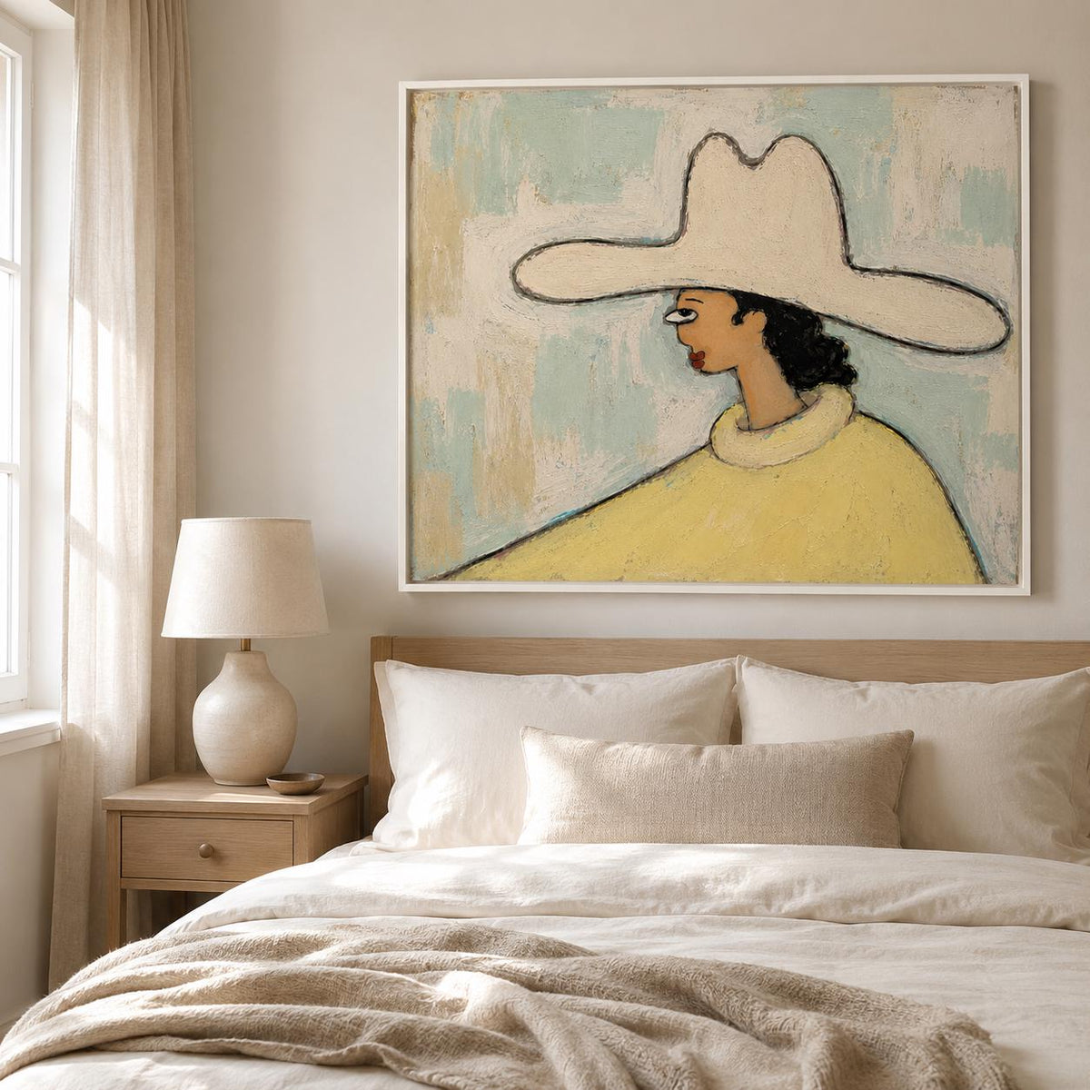 May include: A framed wall art print featuring a stylized painting of a person in profile wearing a wide-brimmed cream hat and a yellow sweater. The background consists of textured, light blue and off-white brushstrokes on a canvas surface.