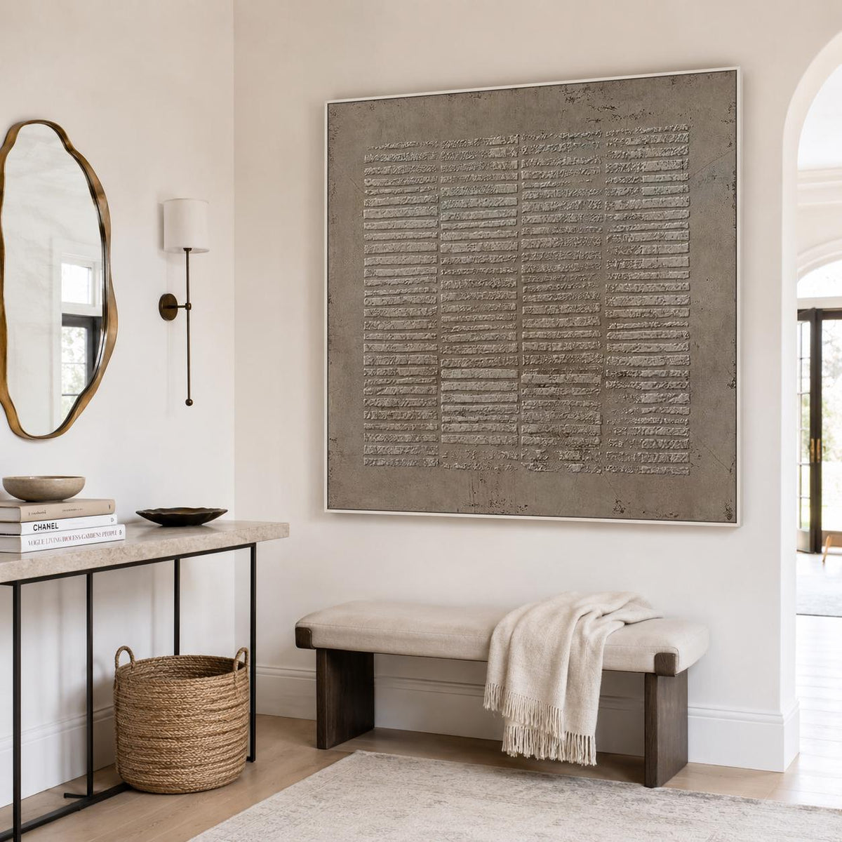 May include: A large square wall art piece featuring a textured taupe surface with horizontal raised lines, framed in a thin white border. The artwork displays a grid-like pattern of embossed rectangular segments across the entire canvas.