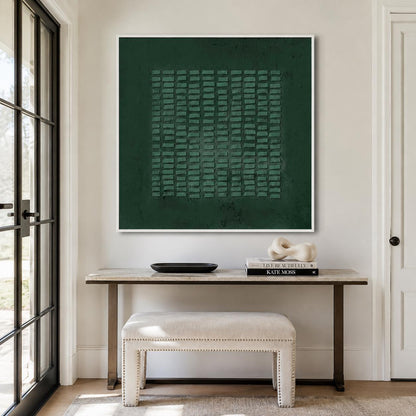 May include: A square wall art piece featuring a deep forest green background with a central grid of raised, rectangular textured blocks in a lighter shade of green, all enclosed within a thin, clean white frame mounted on a neutral wall.