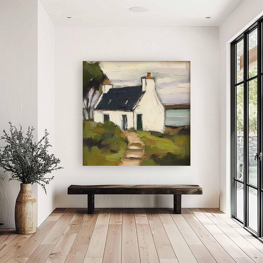 May include: Oil painting of a white cottage with a dark roof, set against a backdrop of green foliage and a muted sky. A path leads to the cottage, evoking a sense of tranquility. The artwork is displayed in a bright, modern interior.