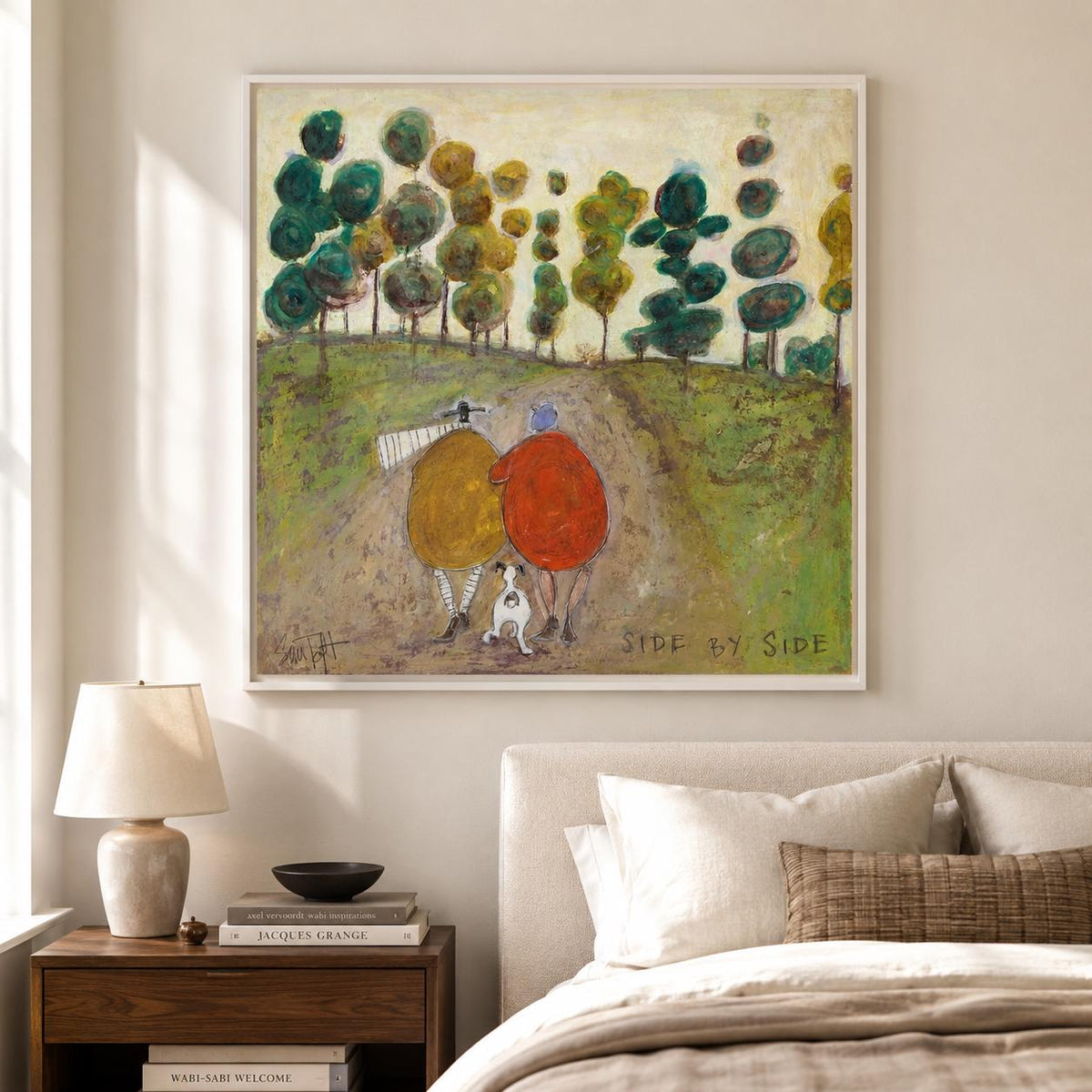 May include: A square framed painting depicts two figures in yellow and red coats walking with a small white dog on a dirt path through a green landscape with stylized trees. The text SIDE BY SIDE is printed in the lower right corner of the artwork.