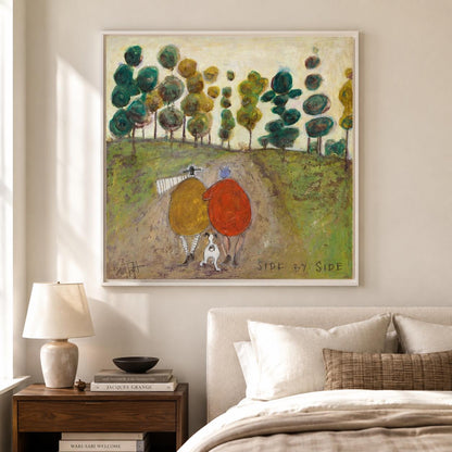 May include: A square framed painting depicts two figures in yellow and red coats walking with a small white dog on a dirt path through a green landscape with stylized trees. The text SIDE BY SIDE is printed in the lower right corner of the artwork.