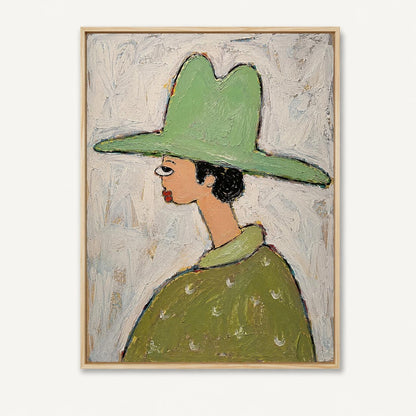 May include: An oil painting in a wooden frame depicting a profile view of a figure wearing a wide-brimmed light green hat and a matching green collared shirt with white crescent patterns. The background is a textured, off-white impasto surface.