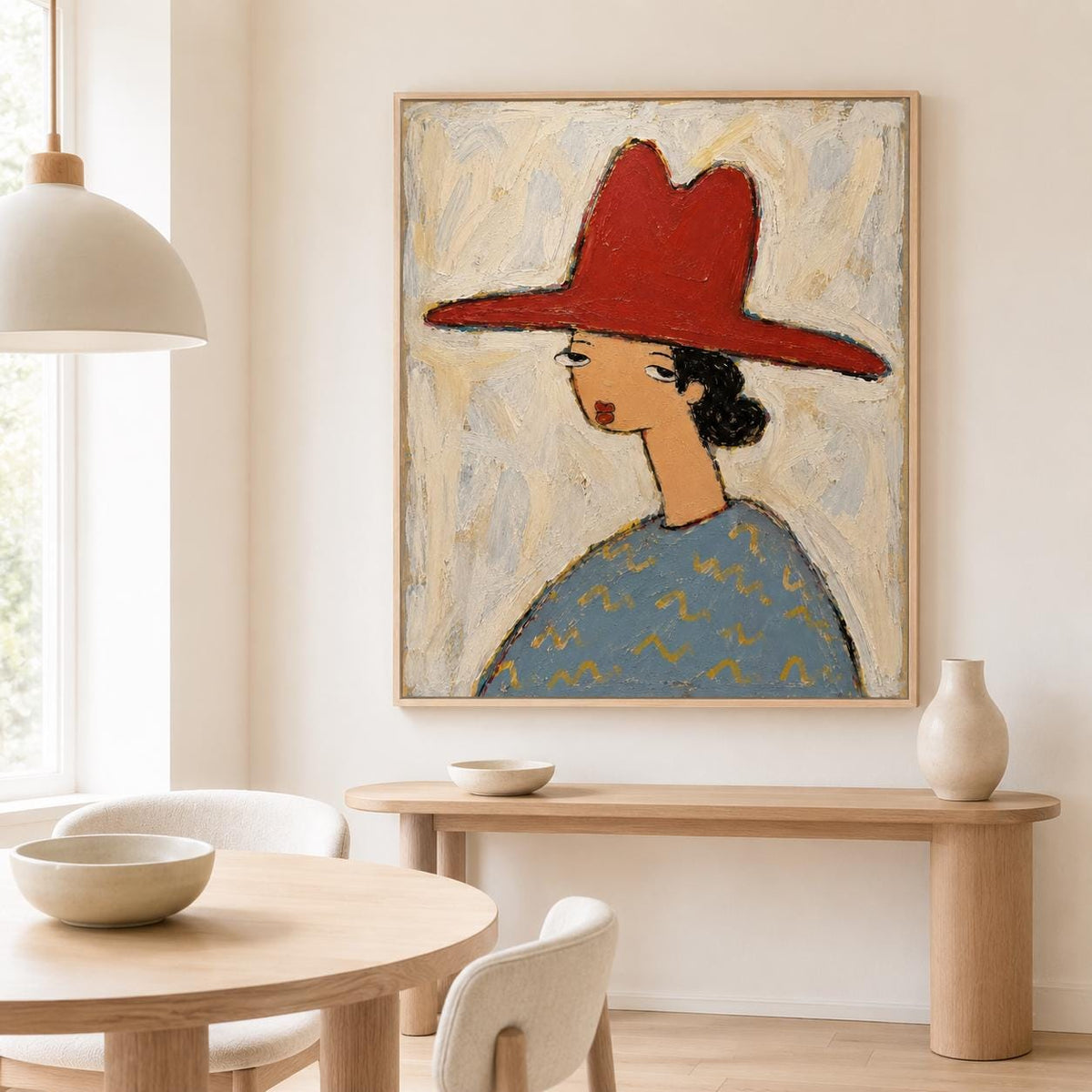 May include: A square framed painting featuring a stylized figure wearing a wide-brimmed red hat. The figure has a tan complexion, dark hair, and a blue shirt with a yellow zigzag pattern. The background is a textured, light cream and pale blue.