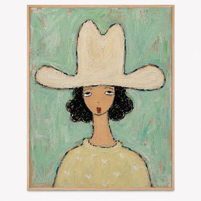 May include: A framed oil painting on canvas depicting a figure wearing a large cream-colored cowboy hat. The figure has dark curly hair, a tan complexion, and a light yellow sweater. The background is a textured, light mint green color.