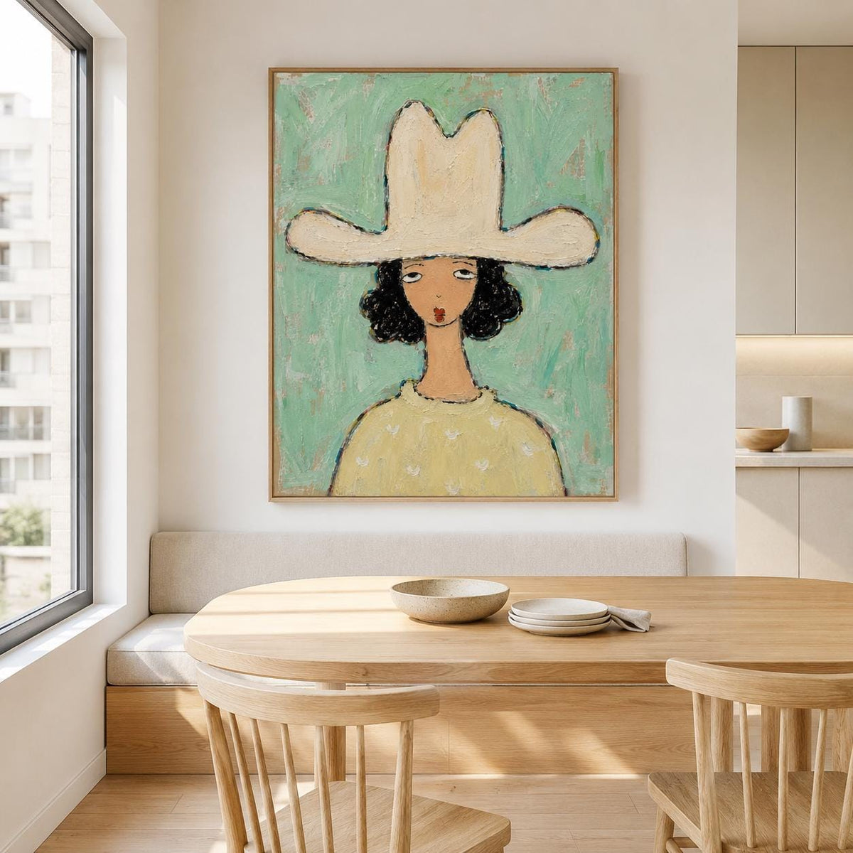 May include: A framed wall art print featuring a stylized painting of a person with dark curly hair wearing a large cream-colored cowboy hat and a pale yellow sweater against a textured mint green background with visible brushstrokes.