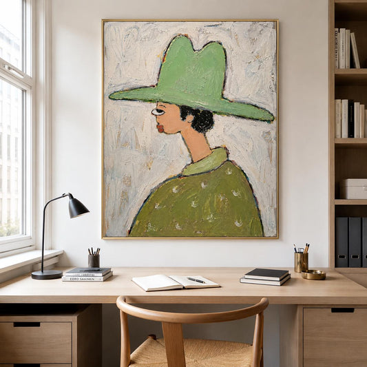 May include: A framed oil painting on canvas depicting a profile view of a figure wearing a wide-brimmed light green hat and a matching green collared shirt with white accents. The artwork features a textured, impasto style against a white background.