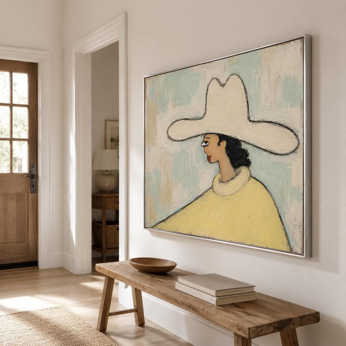 May include: A rectangular framed painting featuring a stylized figure wearing a wide-brimmed cream hat and a yellow high-neck garment. The figure is depicted in profile against a textured, light blue and off-white background with visible brushstrokes.
