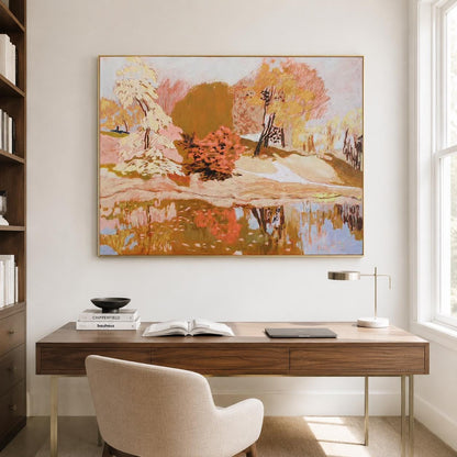 May include: A rectangular landscape painting in a gold frame featuring a park scene with trees in shades of orange, yellow, and cream, reflected in a calm body of water. The artwork uses textured brushstrokes to depict foliage and a path.