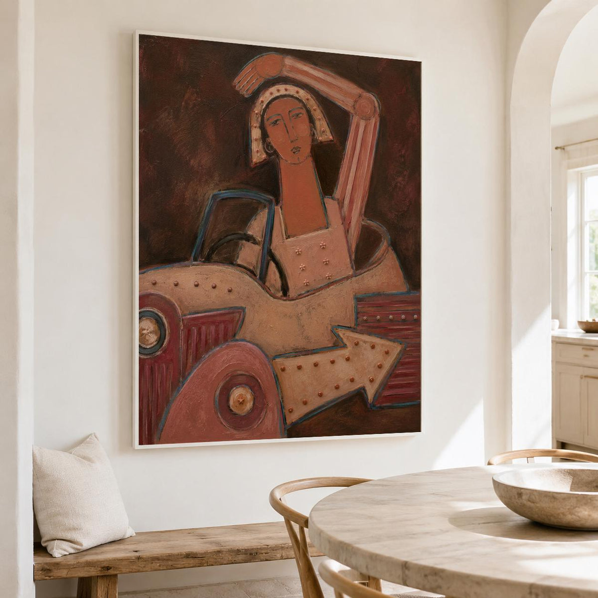 May include: A framed wall art print featuring a stylized painting of a person with a head covering sitting in a vintage-style vehicle. The artwork uses a palette of deep browns, muted reds, and beige tones, with a prominent arrow shape at the bottom.