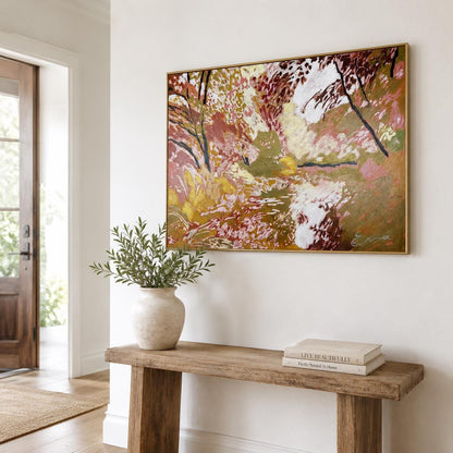 May include: A rectangular landscape painting in a gold frame featuring abstract brushstrokes in shades of ochre, deep red, white, and dark brown. The artwork depicts a forest scene with textured layers of paint and a signature in the bottom right corner.