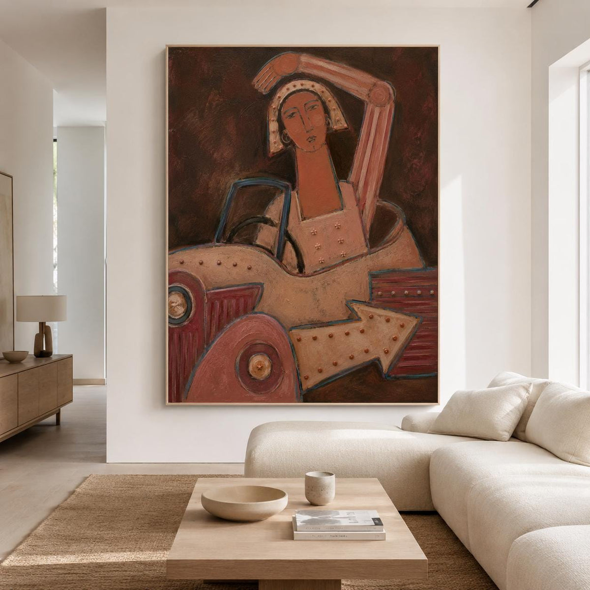 May include: A large rectangular wall art piece featuring a stylized painting of a figure with a tan complexion and a head covering, seated inside a vintage-style vehicle. The artwork uses a palette of deep browns, muted reds, and warm beige tones.