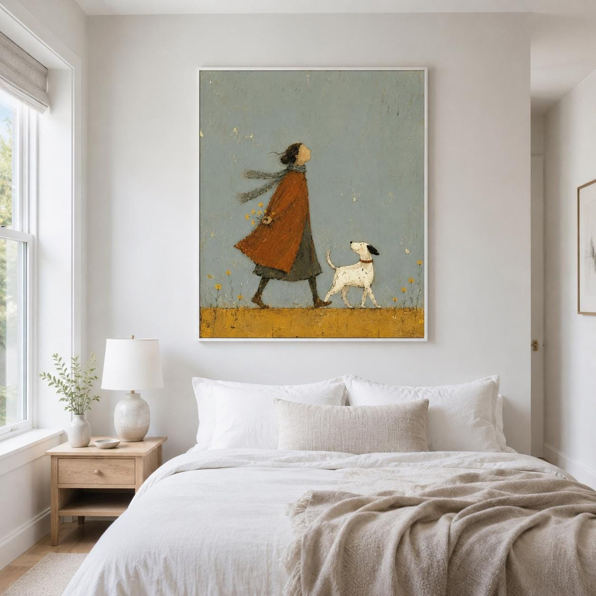 May include: A framed wall art print featuring a stylized illustration of a person wearing a long rust-colored coat and a scarf, walking alongside a small white dog with black spots. The scene is set against a muted blue sky and yellow field.