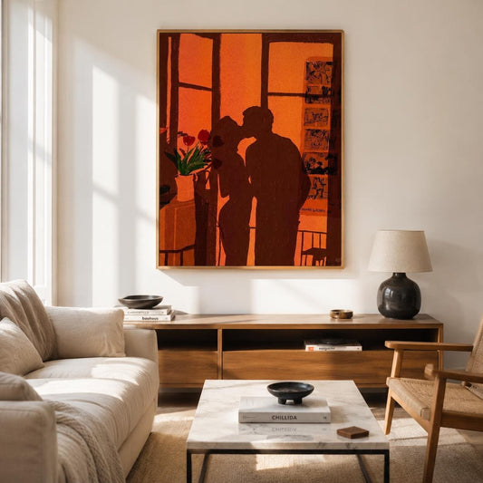 May include: A rectangular wall art print featuring a dark silhouette of two figures kissing against a vibrant orange background. The scene depicts a window frame, a potted plant with red flowers, and a vertical grid of small framed images on the wall.