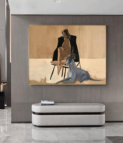 May include: A rectangular framed painting featuring a stylized figure seated on a chair, wearing a black jacket, with a grey dog lying in the foreground. The artwork uses a beige and tan color palette with bold, expressive brushstrokes.
