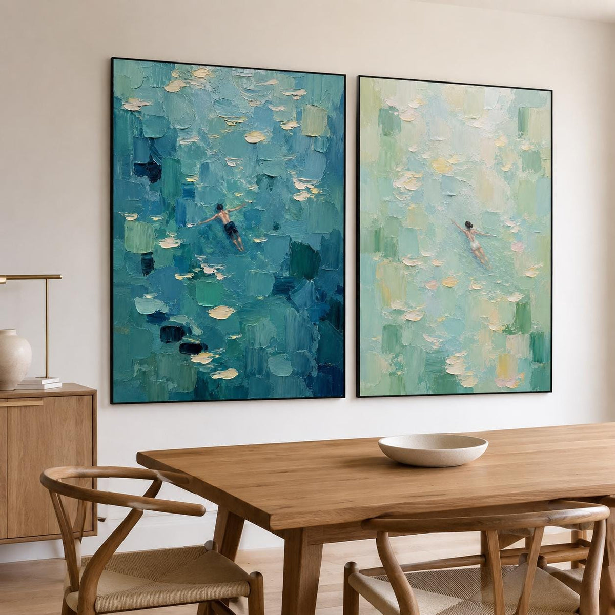 May include: Two rectangular canvas paintings featuring thick, textured impasto brushstrokes. The left painting displays deep blue and teal water with a swimmer. The right painting shows light green and white water with a swimmer in a white suit.