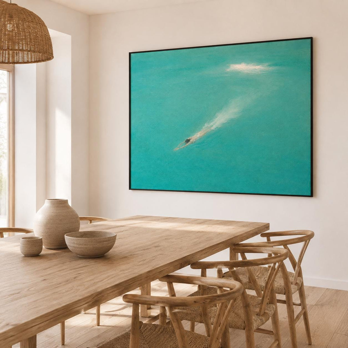 May include: A large rectangular wall art piece featuring an abstract painting of a swimmer in turquoise water. The artwork is framed in a thin black border and depicts a figure moving through bright teal water with a white wake trail behind them.
