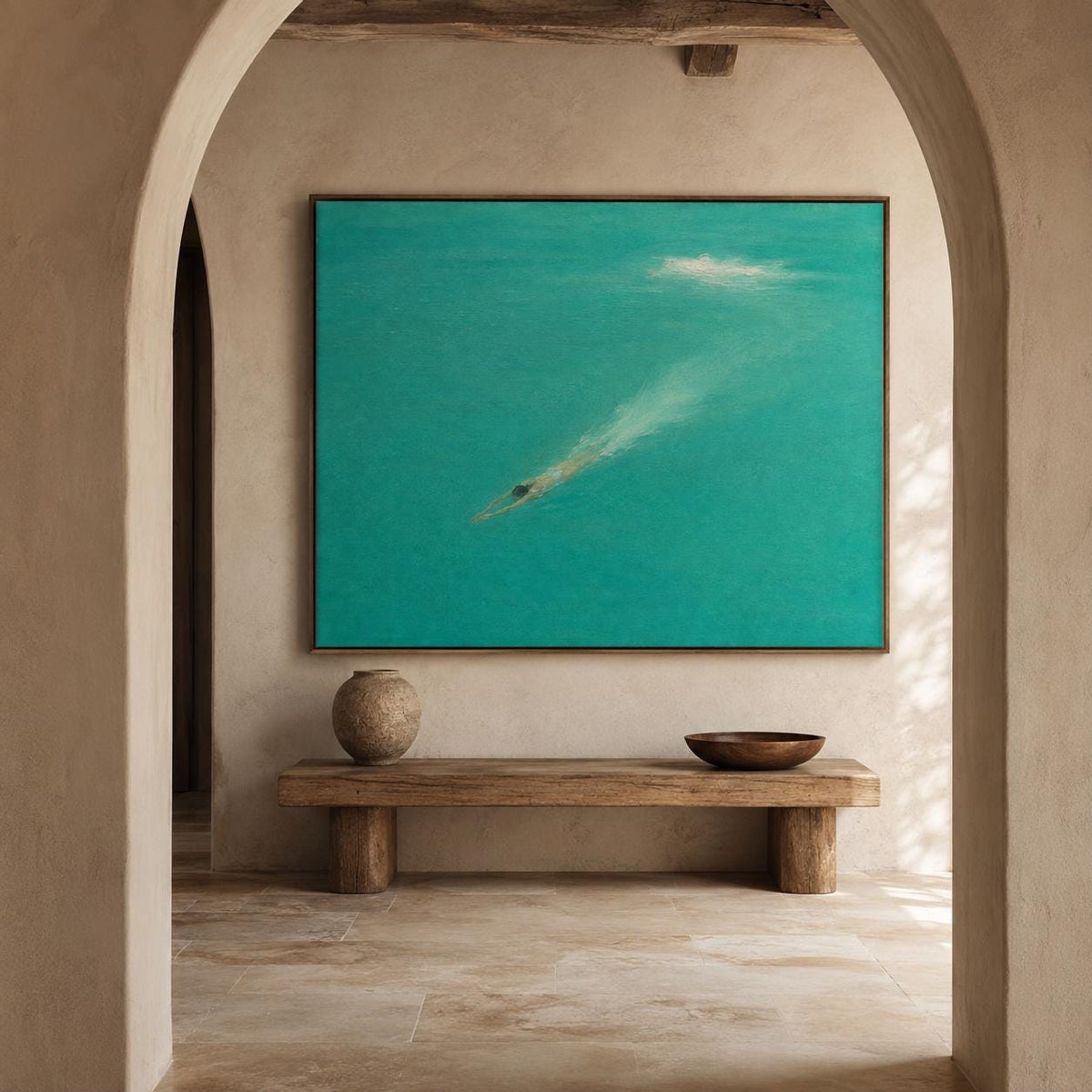 May include: A large rectangular wall art piece featuring a swimmer submerged in vibrant turquoise water, creating a white wake. The painting is framed in thin wood and hangs above a long, low, rustic wooden bench with a round vase and a bowl.