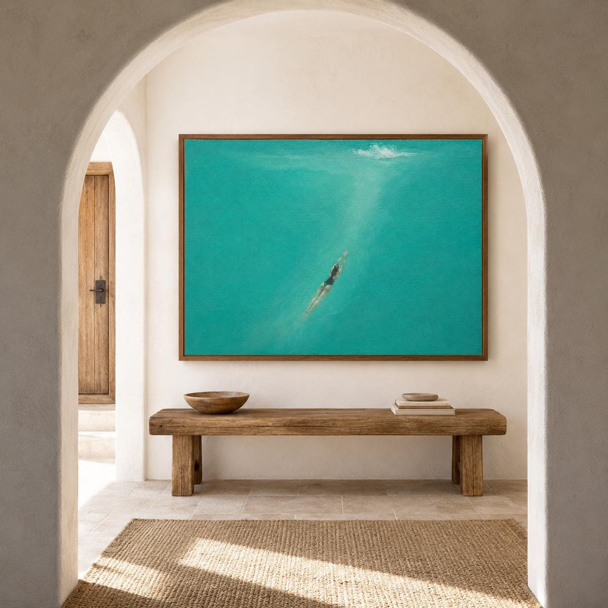 May include: A rectangular wall art piece featuring an oil painting of a person swimming underwater in vibrant turquoise water. The artwork is encased in a thin wooden frame and is displayed above a long, rustic wooden bench with a bowl.