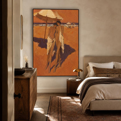 May include: A large rectangular framed wall art piece featuring an oil painting of two figures standing on a sandy beach under a large umbrella. The scene is rendered in warm orange and brown tones with deep purple shadows cast on the sand.