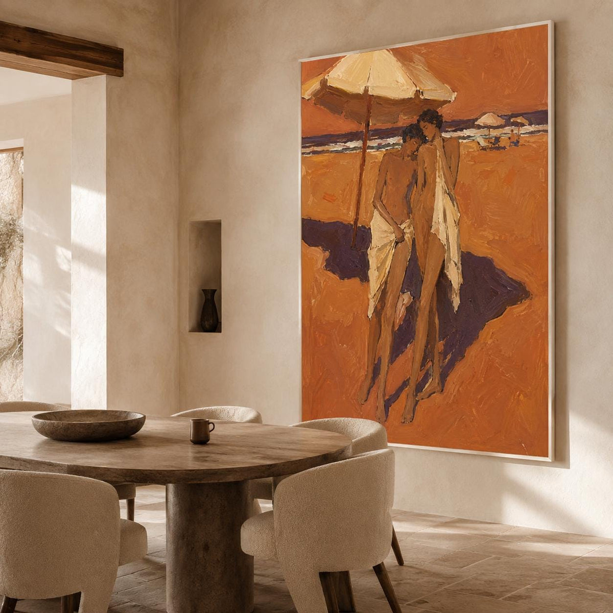 May include: A large vertical oil painting on a wall depicts two figures standing on a sandy beach under a large umbrella. The artwork features warm orange and brown tones with visible brushstrokes, showing the figures draped in white fabric.