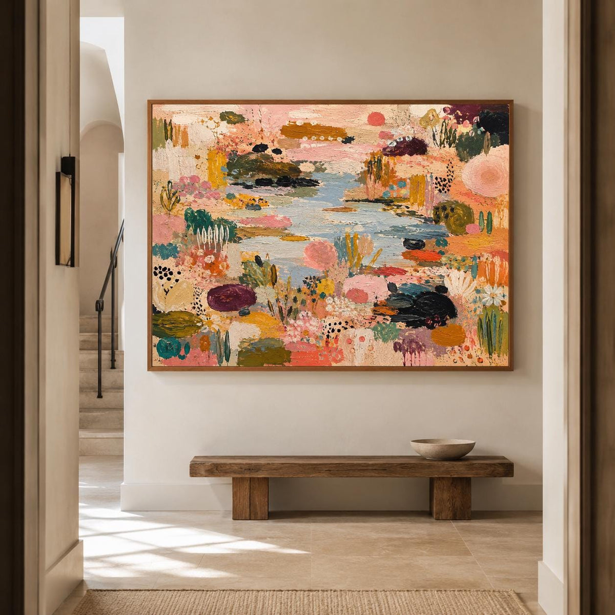 May include: A large rectangular canvas painting featuring an abstract landscape with a central blue water feature surrounded by dense, textured patches of pink, orange, yellow, green, and dark purple paint, all enclosed in a thin wooden frame.