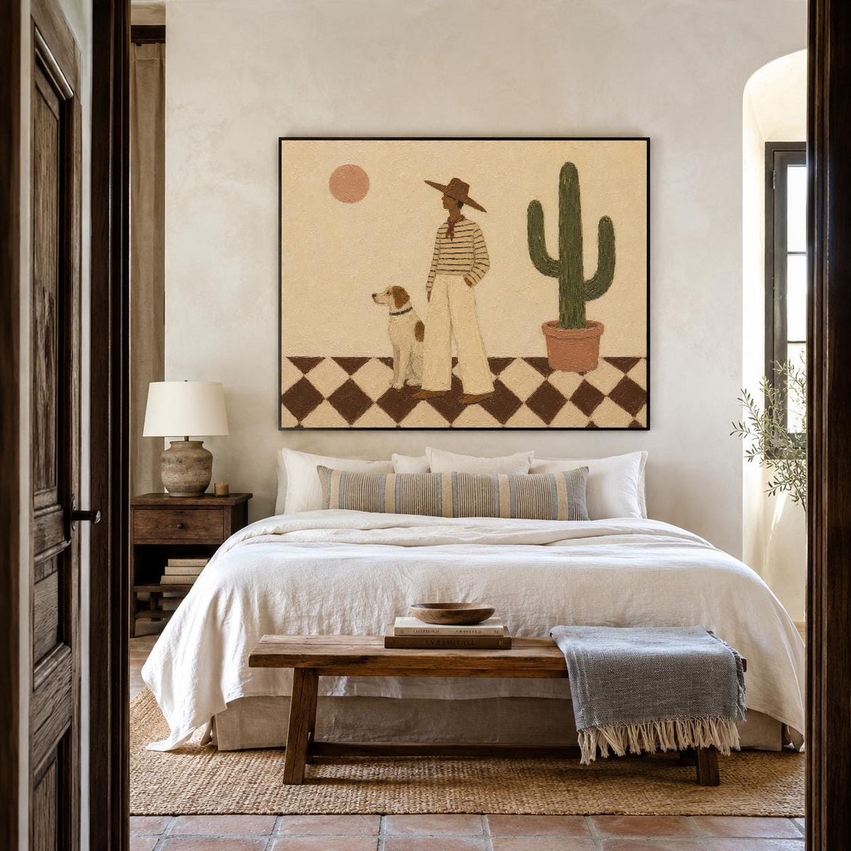 May include: A framed wall art print featuring a stylized illustration of a person in a wide-brimmed hat and striped shirt standing with a dog next to a potted cactus. The scene is set on a brown and white checkered floor under a pale sun.