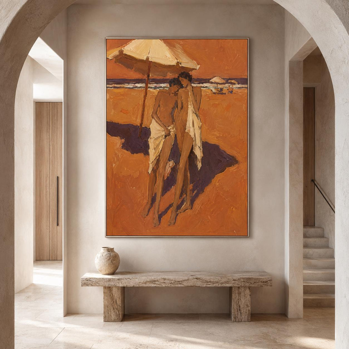 May include: A framed oil painting depicting two figures standing on a sandy beach under a large umbrella. The scene is rendered in warm shades of orange and brown, with deep purple shadows cast on the sand. The figures are draped in white fabric.