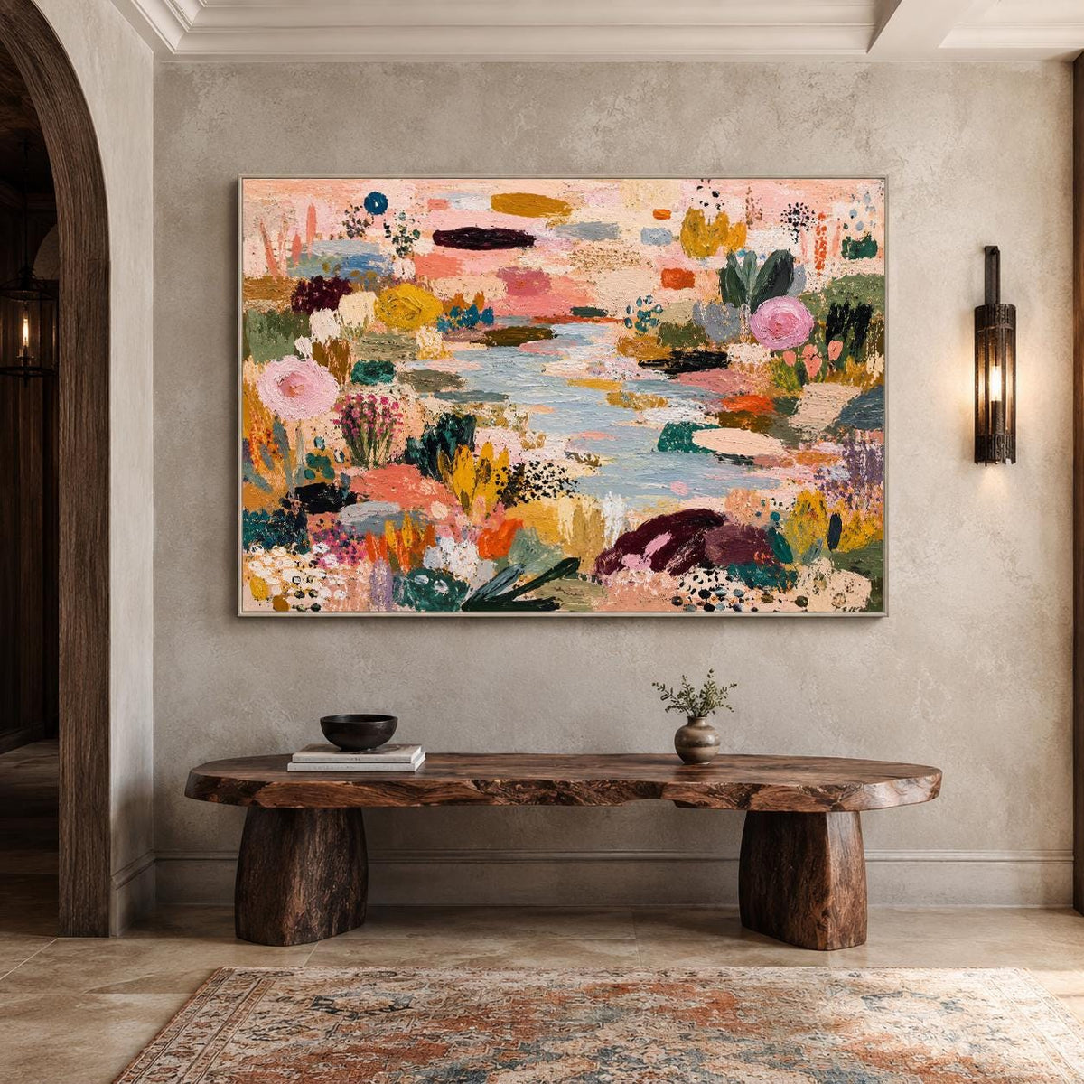 May include: A large rectangular canvas painting featuring an abstract landscape with a central light blue river surrounded by textured patches of pink, yellow, orange, dark green, and deep purple paint, framed in a thin metallic border.