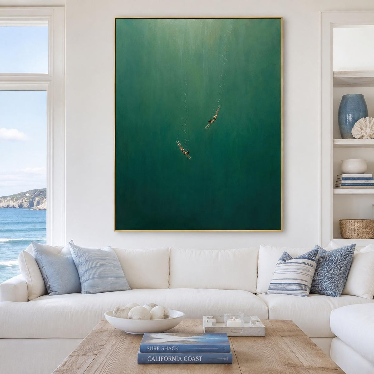 May include: A large rectangular wall art piece featuring a deep emerald green ocean scene. Two small figures are depicted swimming in the vast, dark water, creating a sense of scale. The artwork is framed in a thin gold border, emphasizing the vertical orientation of the painting against the wall.